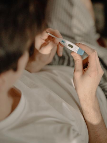 Person checks thermometer
