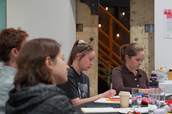 This is a picture of young people working at a table
