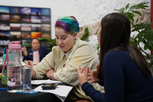A young person speaking to a youth worker.